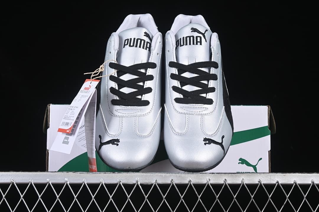 Front view of the pair showing silver uppers, black laces and Puma tongue branding.