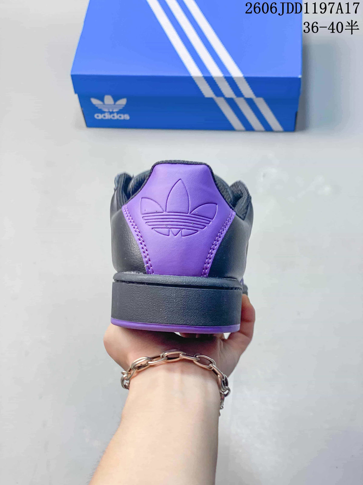 Rear view showing the purple heel panel and Trefoil mark on an adidas Superstar ST sneaker