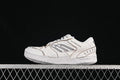 Side view of white Balenciaga Hamptons sneakers with layered panels and a side motif