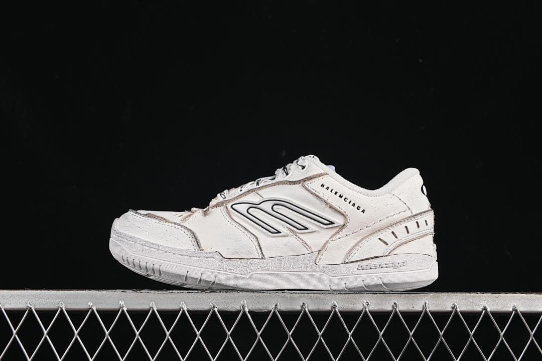 Side view of white Balenciaga Hamptons sneakers with layered panels and a side motif