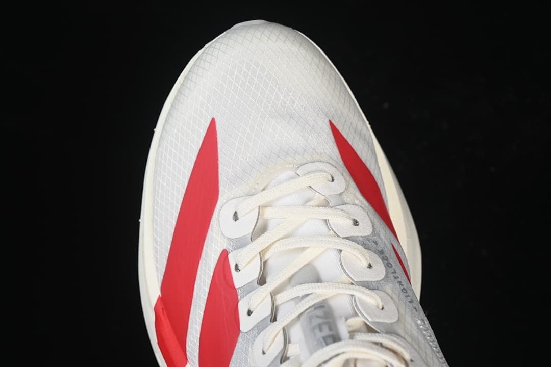 Top view of the shoe toe, laces, and red side stripes