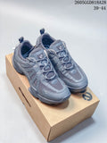 Pair of gray Ecco mesh-panel sneakers shown from above on a shoe box