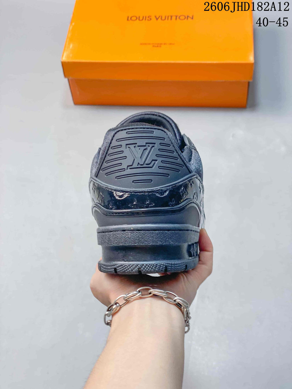 Rear view of a dark navy Louis Vuitton Trainer sneaker