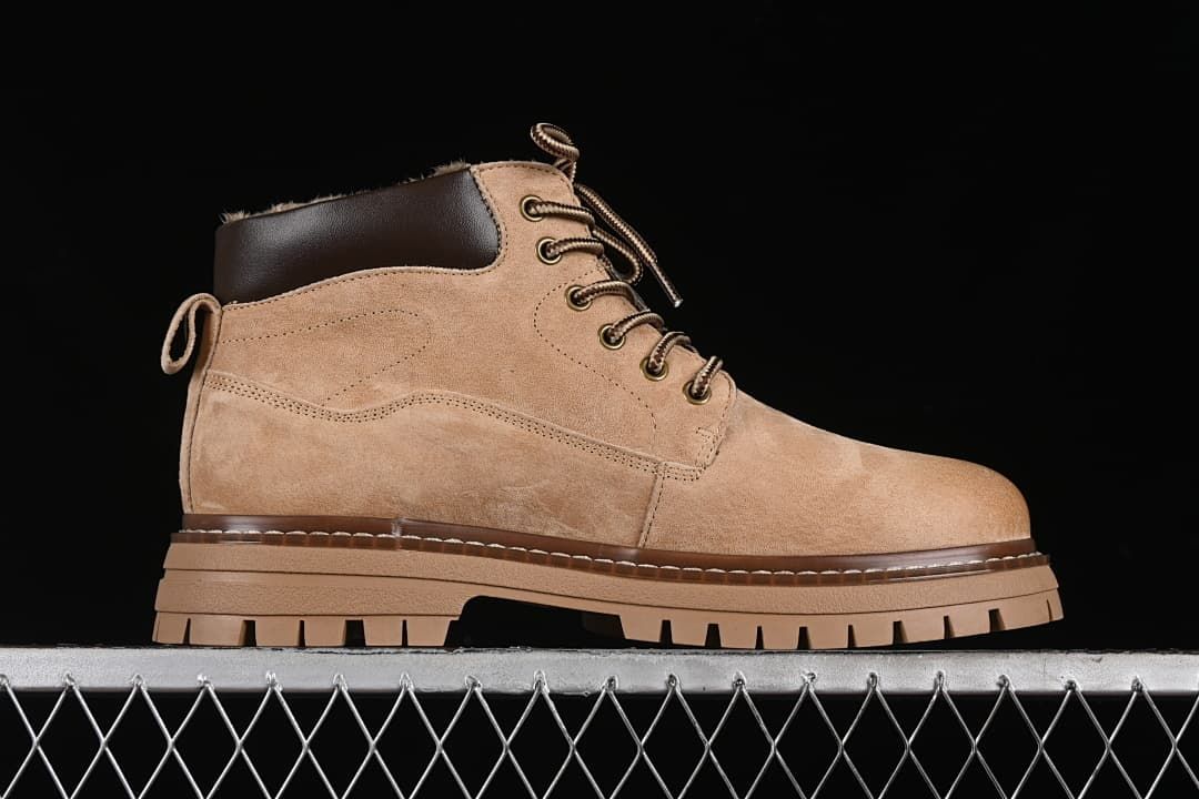 Side profile showing the beige boot upper, dark collar and chunky sole