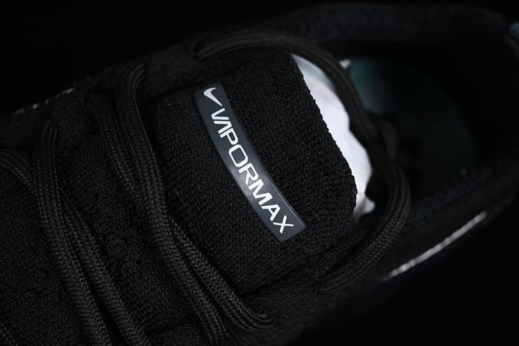 Close-up of the black tongue with VaporMax branding.