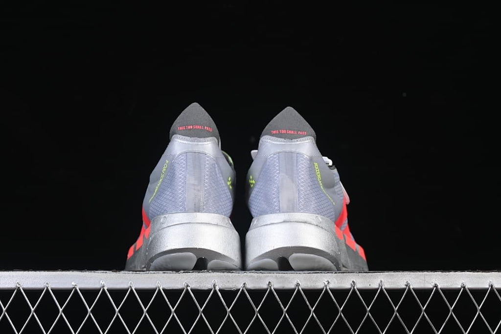 Rear view of the pair showing heel details and sculpted midsoles