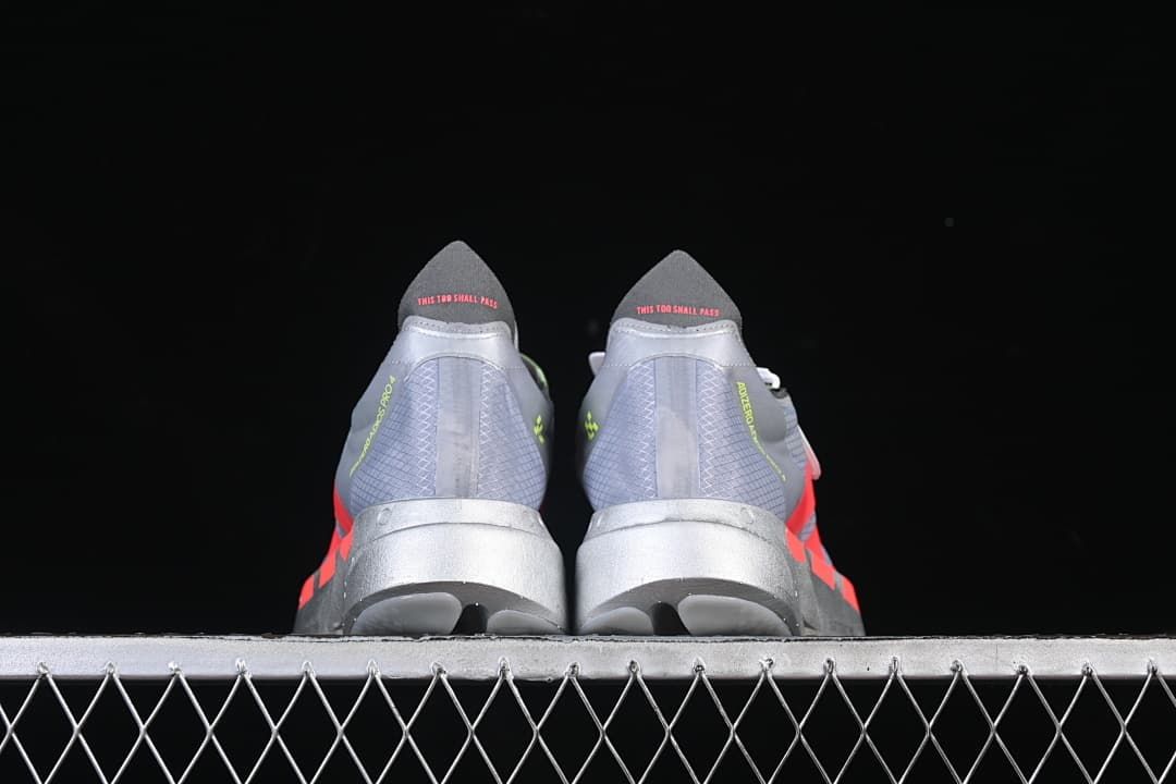 Rear view of the pair showing heel details and sculpted midsoles