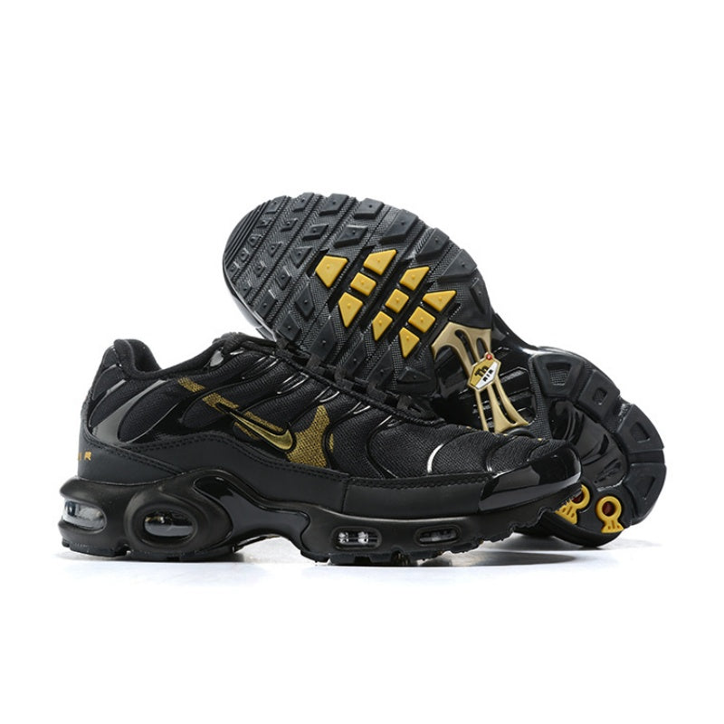 Black Nike Air Max Plus sneakers shown from the side and outsole, with yellow accents.