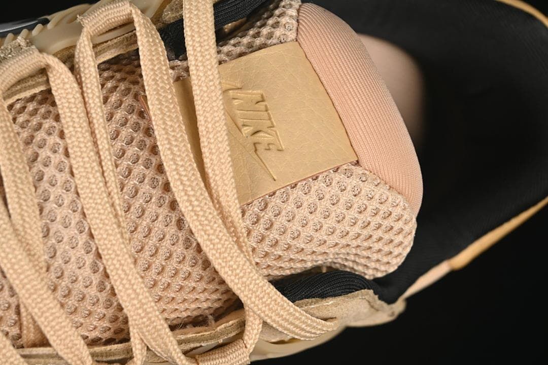 Close-up of the mesh tongue, laces, and embossed Nike branding
