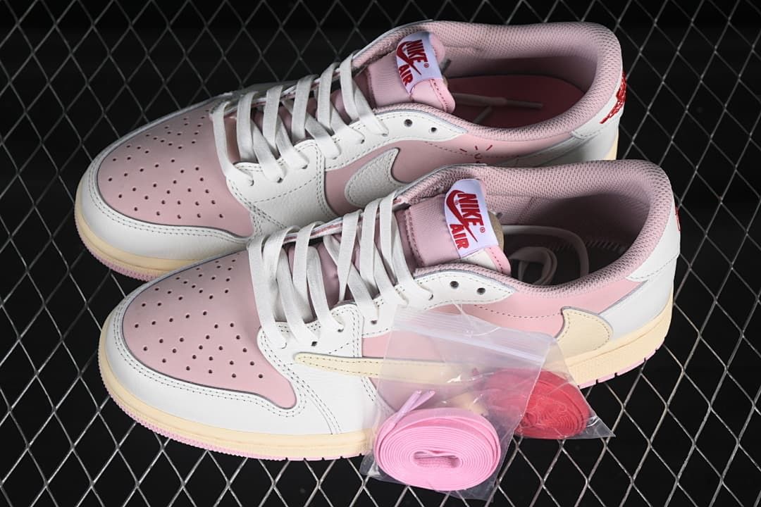 Pair of pink and white low-top sneakers with an extra set of pink laces