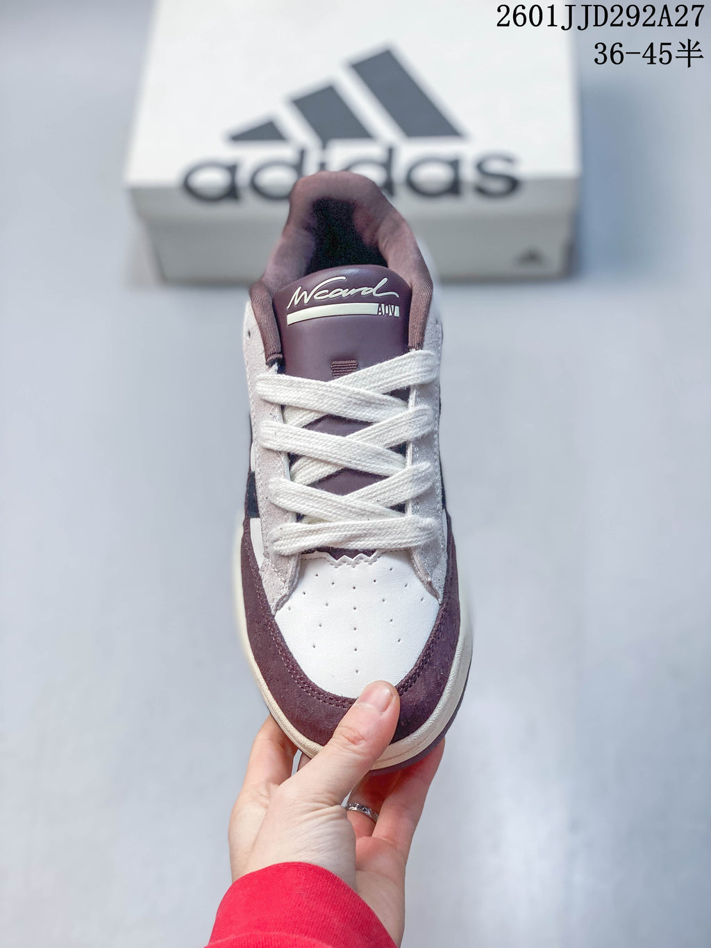 Front view of an Adidas Wcard Adv sneaker showing the laces, perforated toe area and contrasting trim.