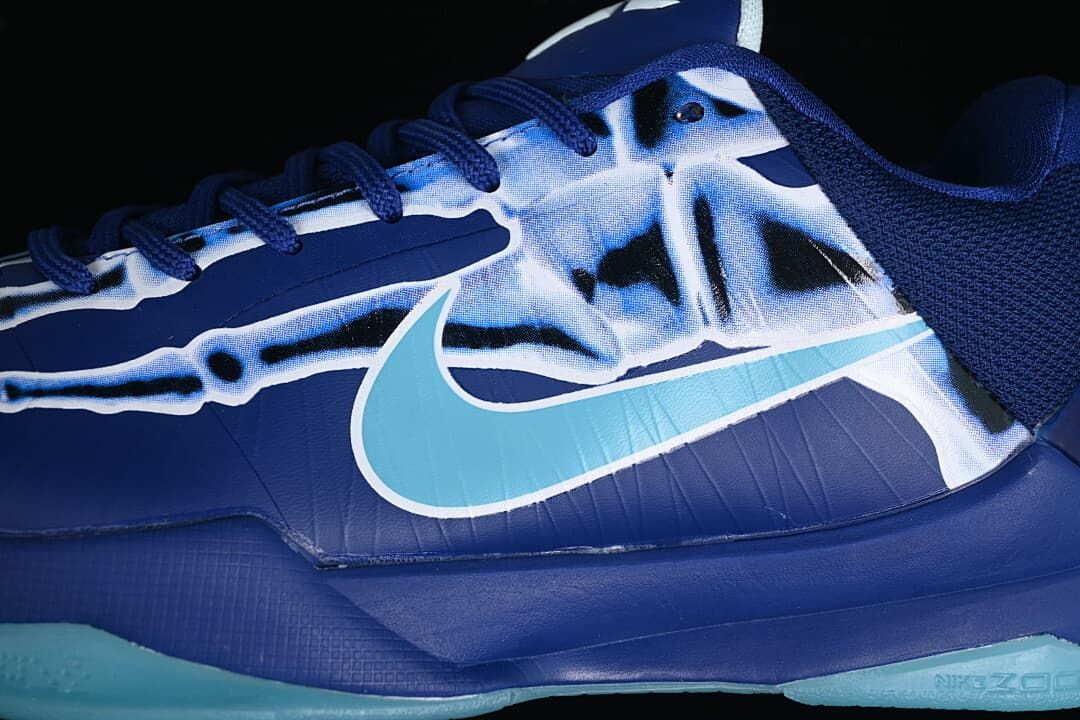 Close-up of the skeletal upper graphic and aqua Swoosh