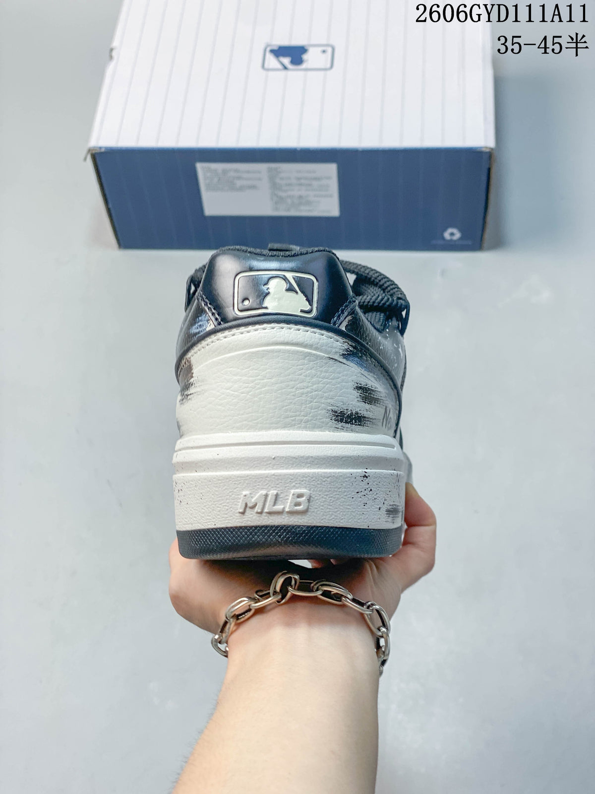 Rear view of the sneaker showing the heel panel and MLB lettering.