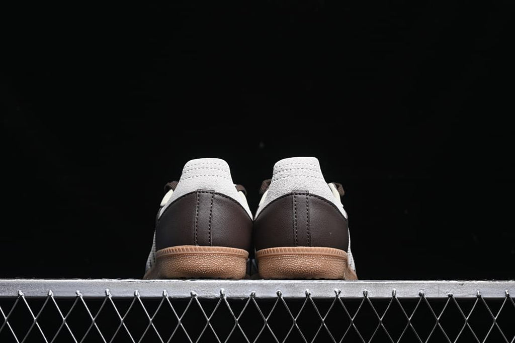 Rear view of the pair showing brown heel panels and light heel overlays