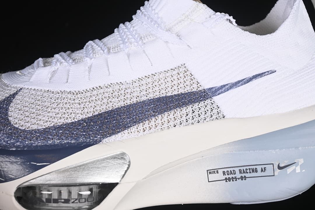 Close-up of the patterned upper, navy Swoosh and forefoot cushioning window
