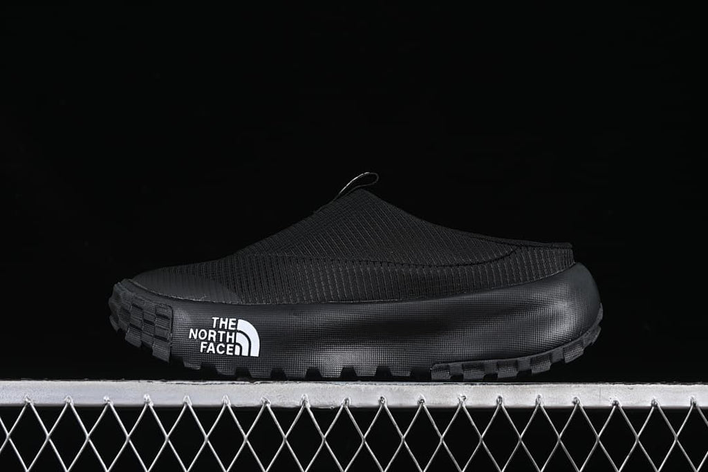 Black The North Face slip-on mule shown from the side