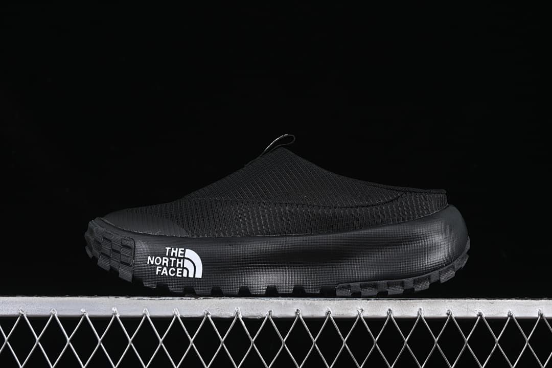 Black The North Face slip-on mule shown from the side