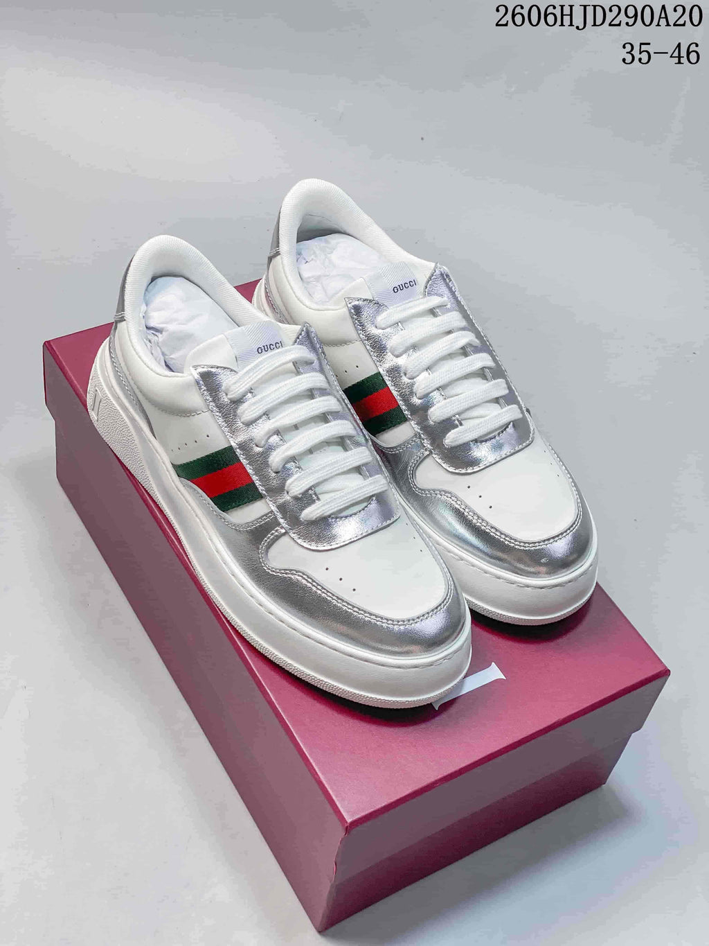 Pair of white and silver Gucci Chunky low-top sneakers with green-and-red side stripes