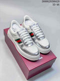 Pair of white and silver Gucci Chunky low-top sneakers with green-and-red side stripes