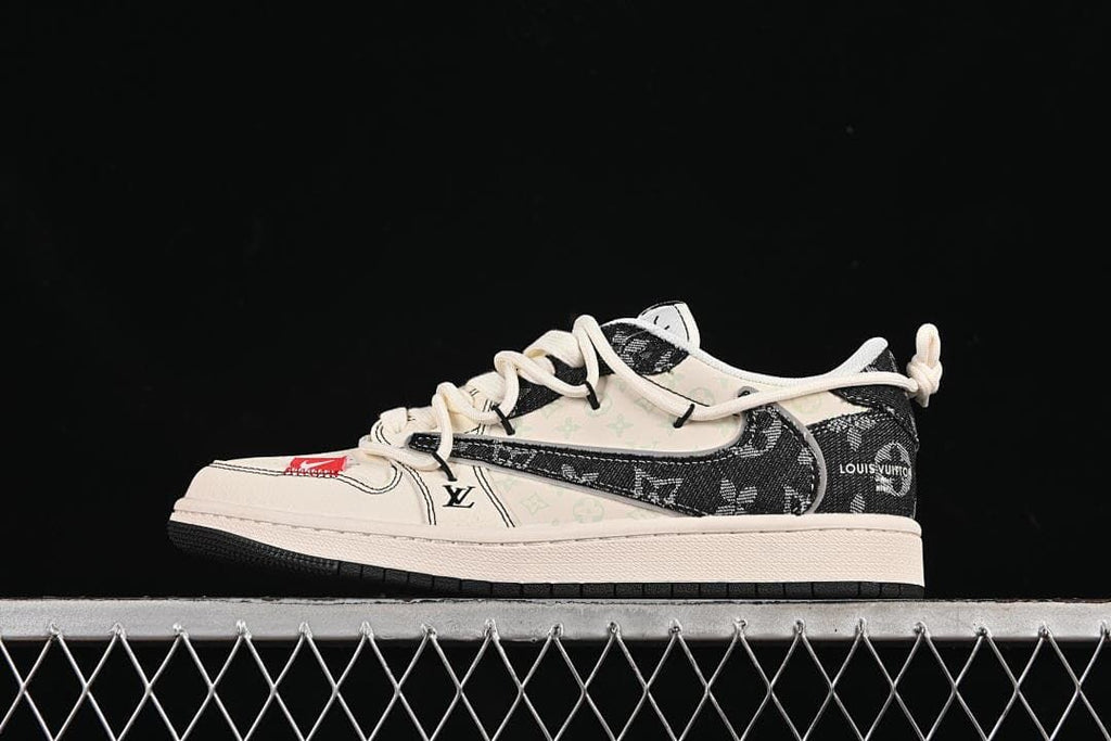 Side view of an off-white and black low-top sneaker with patterned panels, cream laces, and red accents.