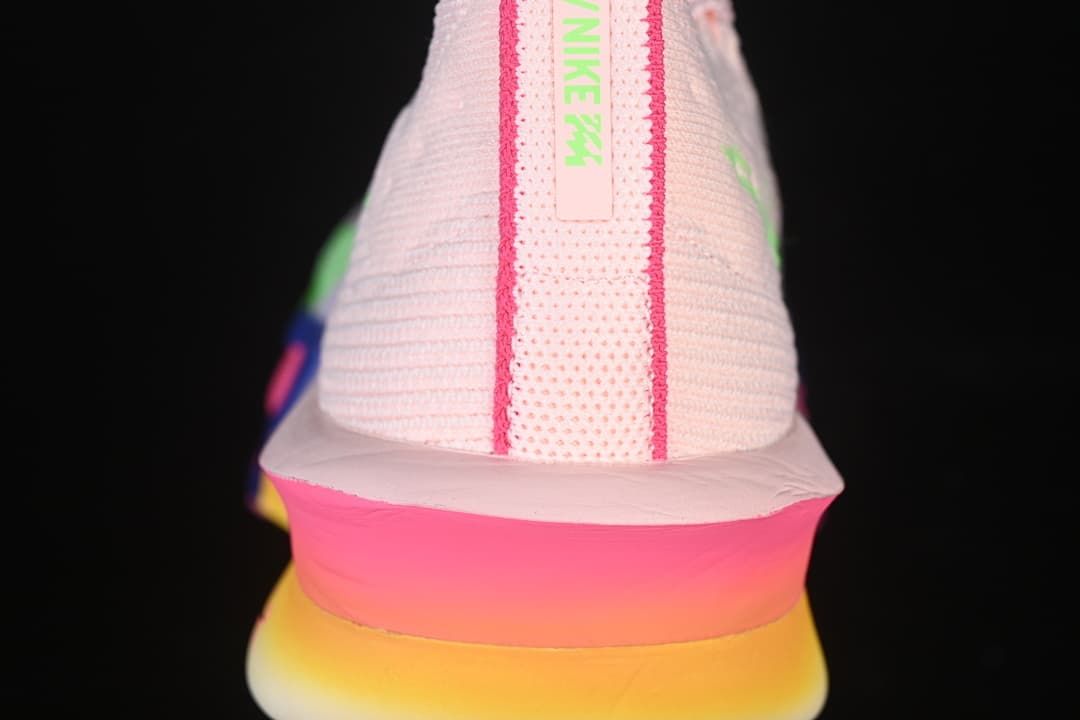 Rear view showing the pink heel and yellow-to-pink sole