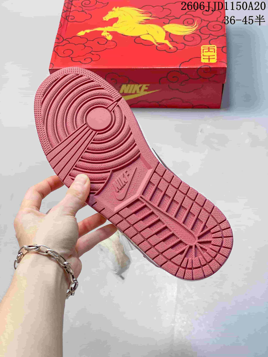 Close-up of the red outsole and tread pattern