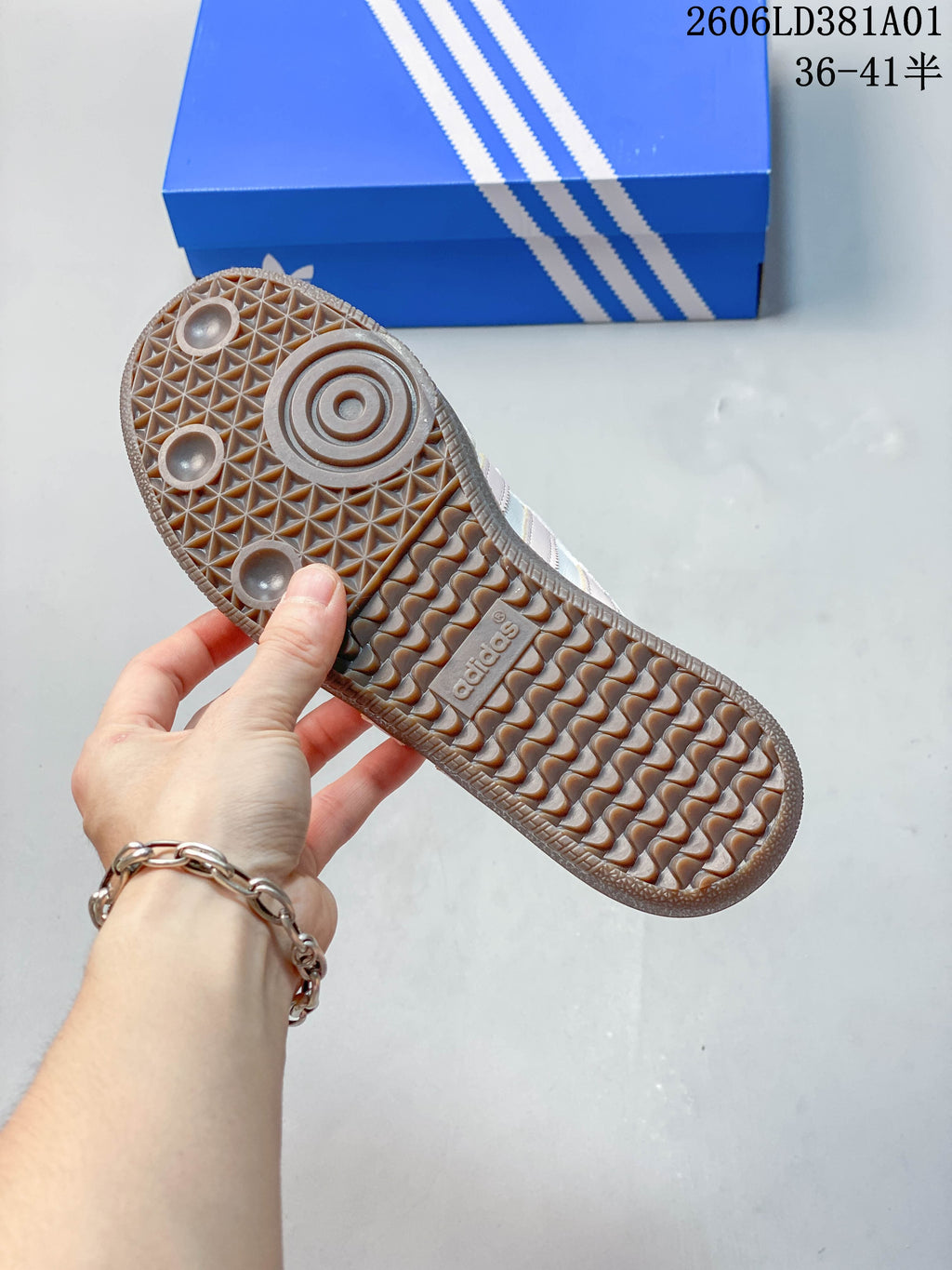 Underside of the sneaker showing a gum-colored patterned outsole