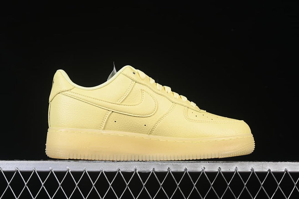 Side profile of the pale yellow sneaker