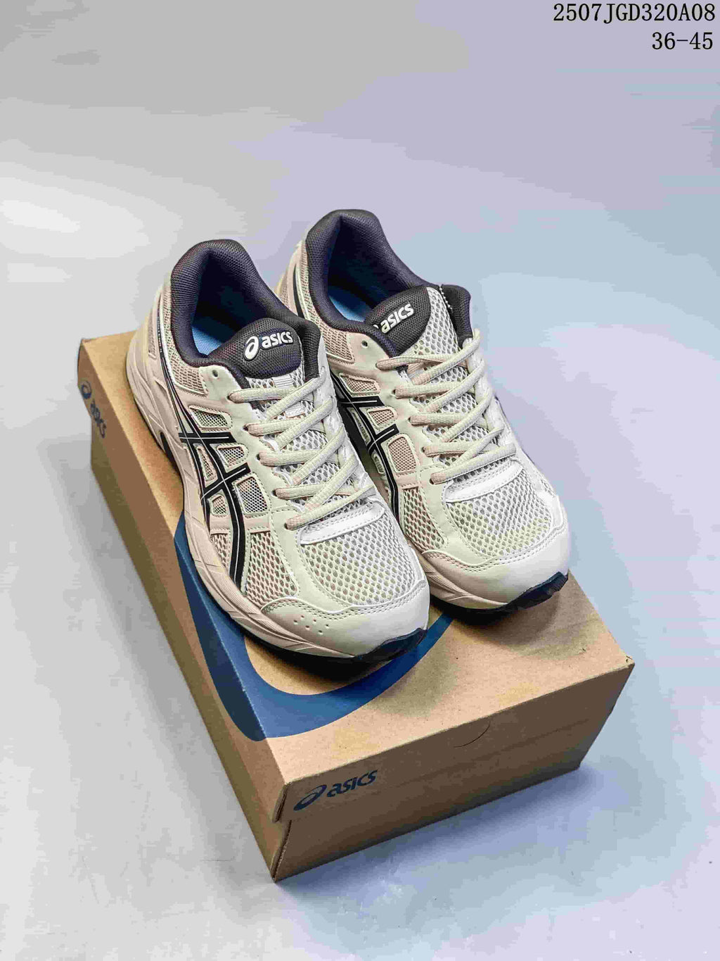 Pair of gray and off-white ASICS Gel-Contend 4 sneakers with navy accents, displayed on a shoebox.