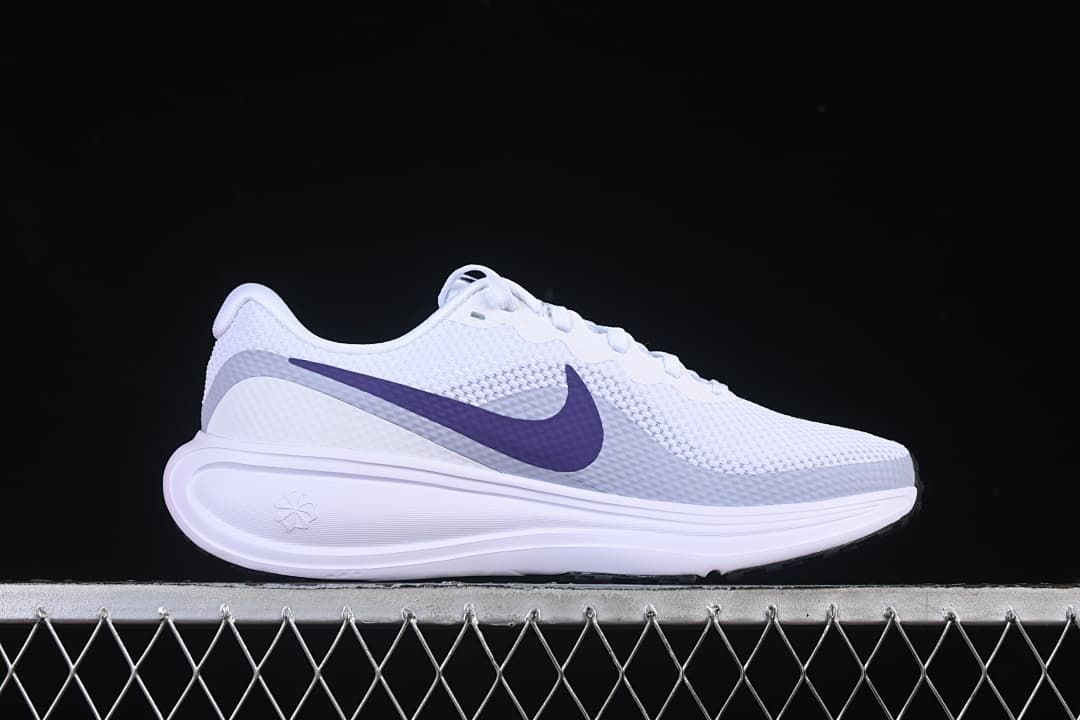 Side profile of the white running shoe with purple Swoosh