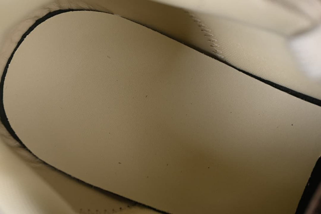 Close-up of the interior lining and stitched edge