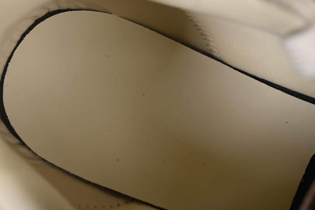Close-up of the interior lining and stitched edge