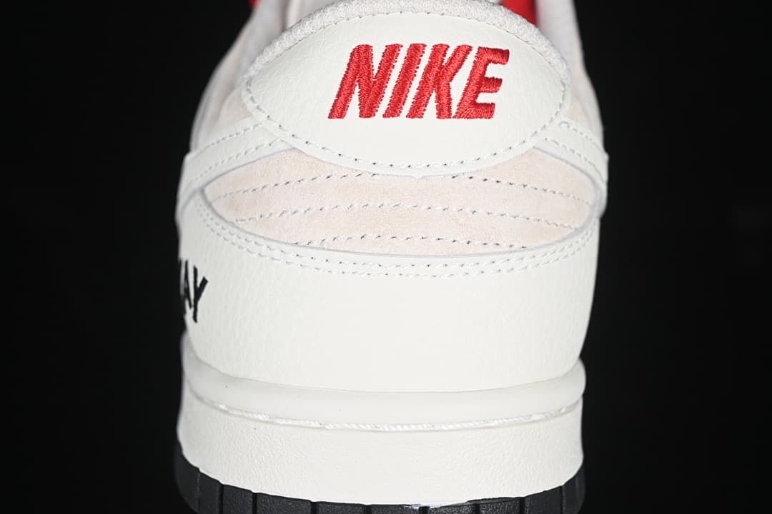 Rear view showing red Nike heel branding, pale beige panels, and black outsole