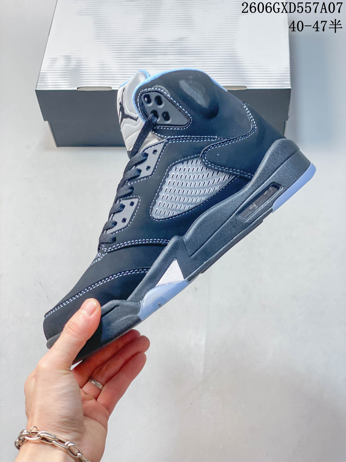 Side view of a dark gray Jordan Air Jordan 5 high-top sneaker with mesh panel, stitched overlays, and translucent outsole accents.