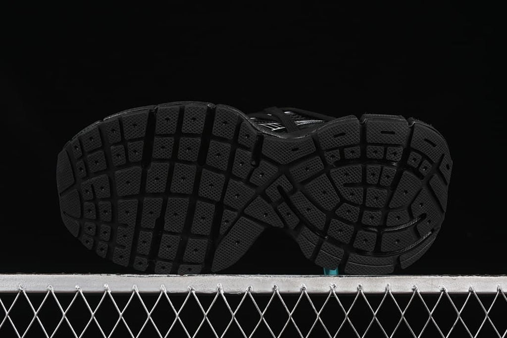 Underside view showing the segmented tread pattern.