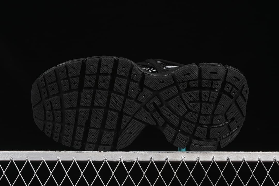 Underside view showing the segmented tread pattern.