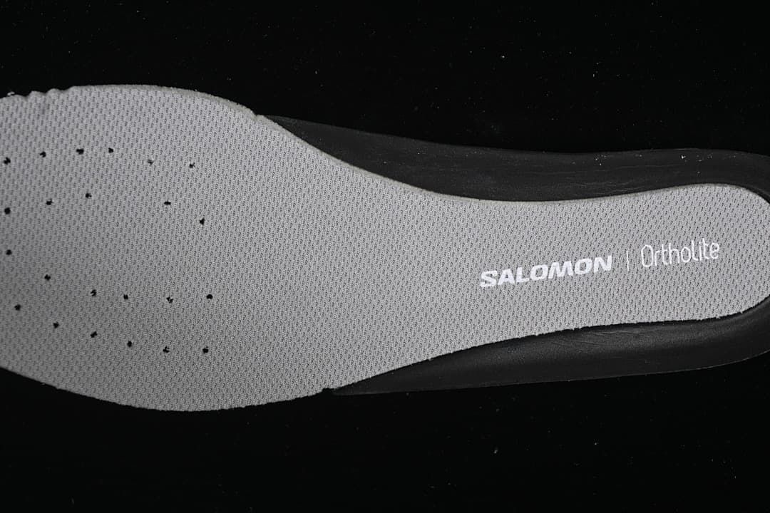Close-up of the insole printed with Salomon and Ortholite branding.