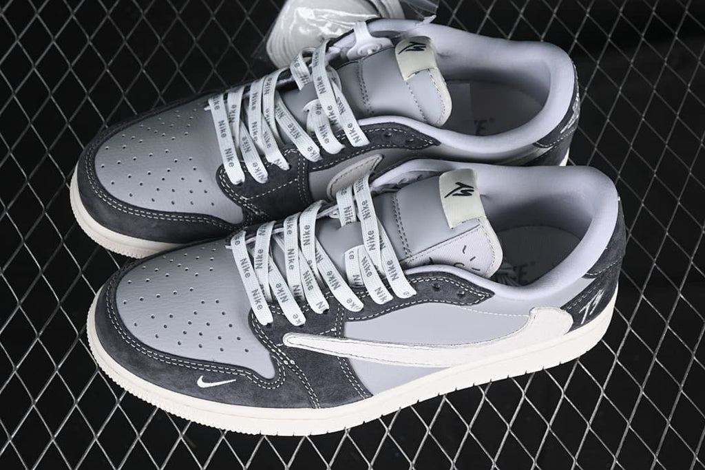 Pair of grey and charcoal low-top sneakers shown from above