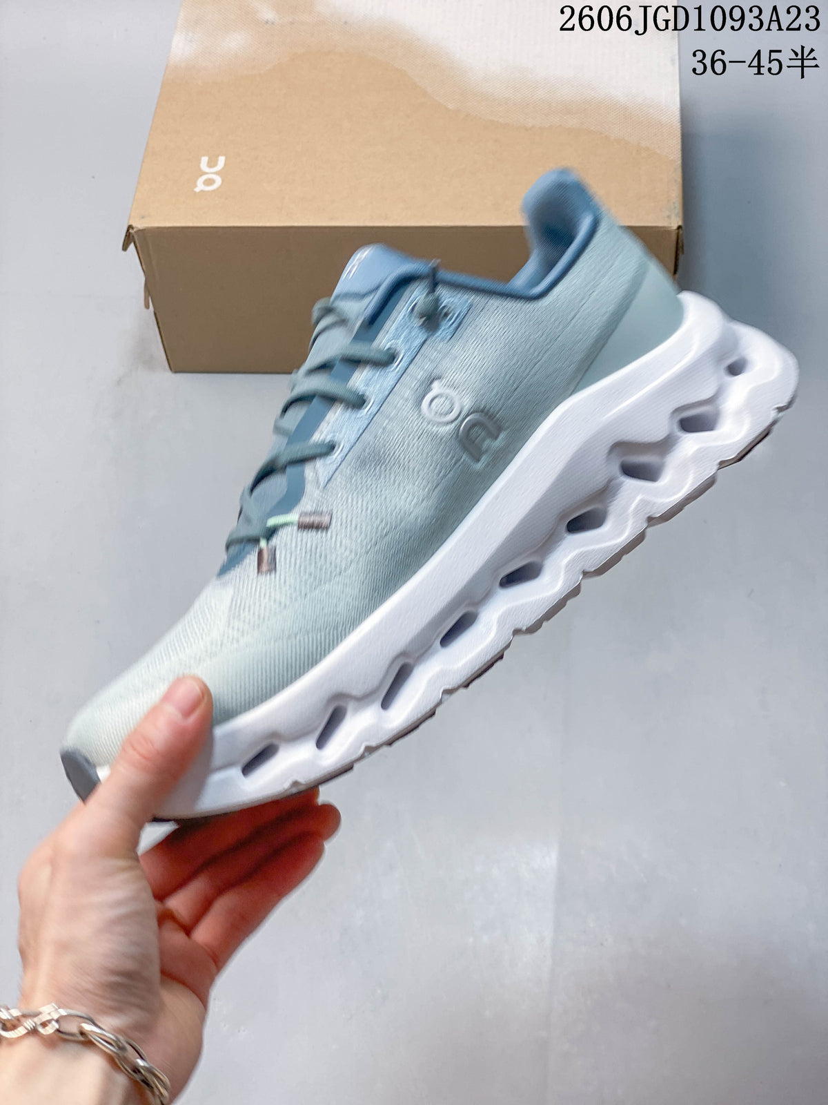 Side view of the pale blue sneaker with its sculpted sole