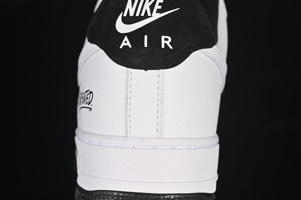 Rear view of the sneaker showing the black heel tab and white heel panel