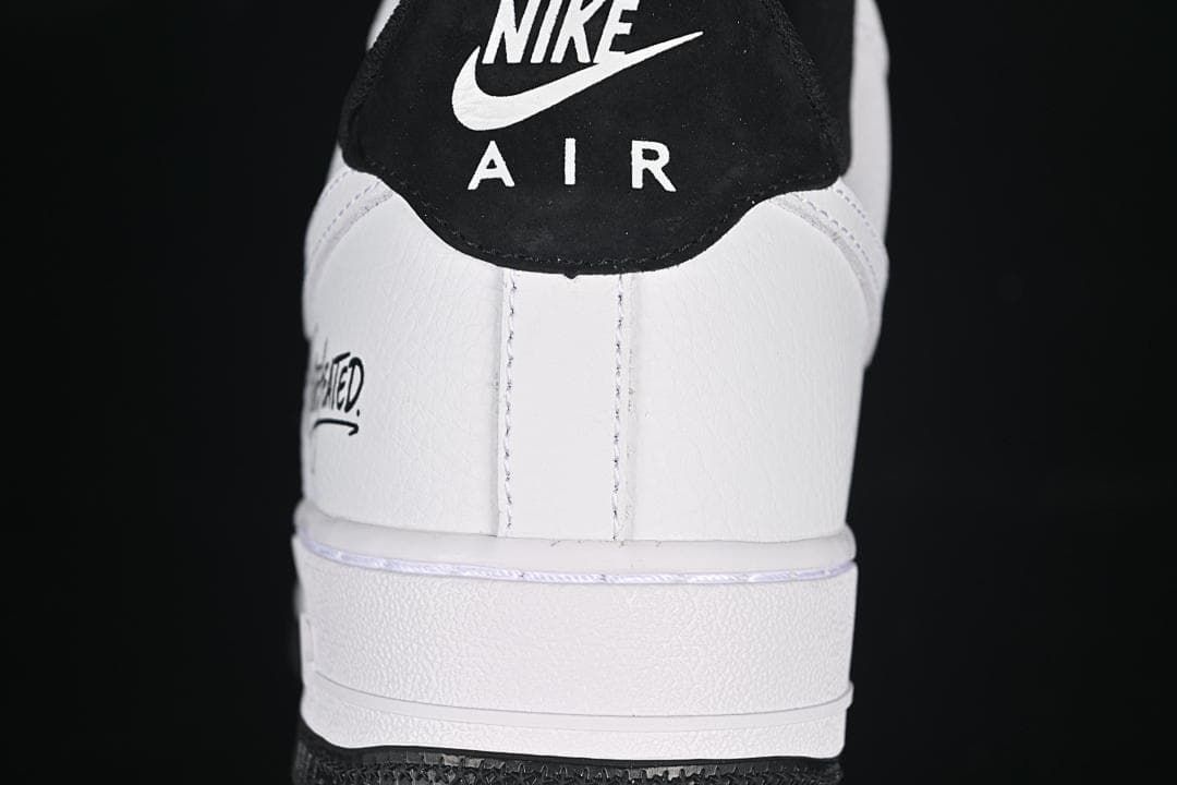Rear view of the sneaker showing the black heel tab and white heel panel