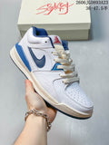 White and blue Jordan Stadium 90 sneaker with a perforated toe and layered panels