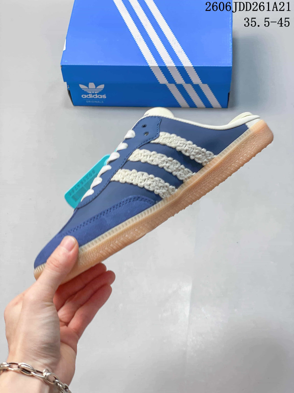 Side profile of the blue Samba Mule with cream textured stripes