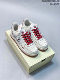 Pair of off-white and burgundy Nike Air Force 1 sneakers with leopard-print Swoosh panels