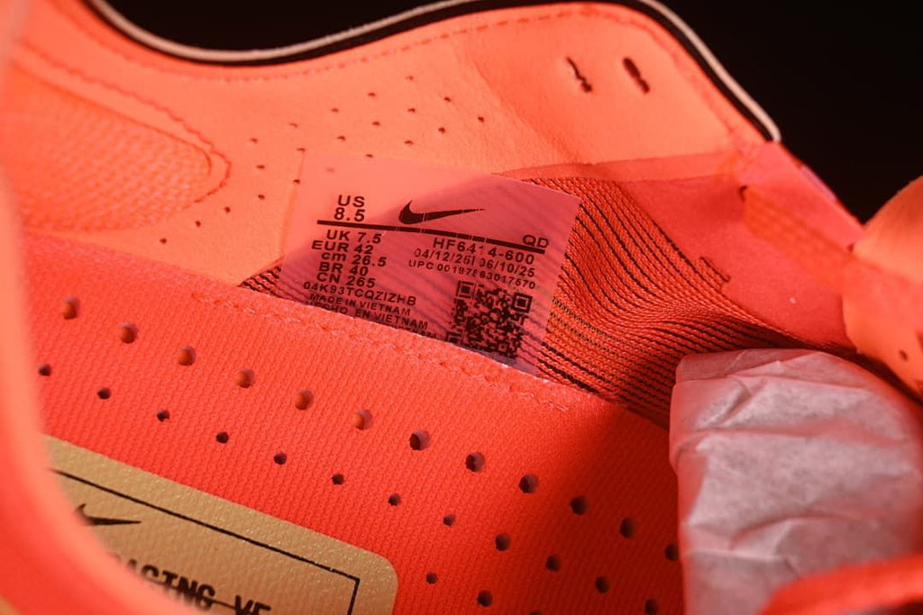Close-up of the shoe size label showing EU 42 and style code HF6414-600.