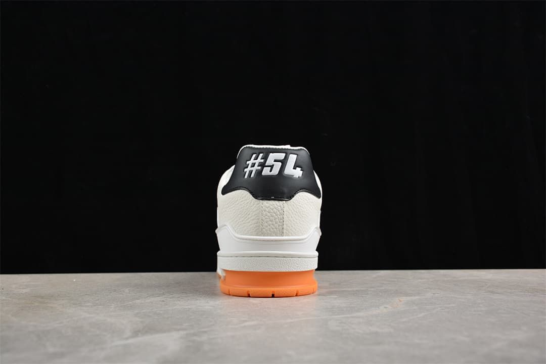 Rear view of the sneaker showing the heel panel and orange outsole