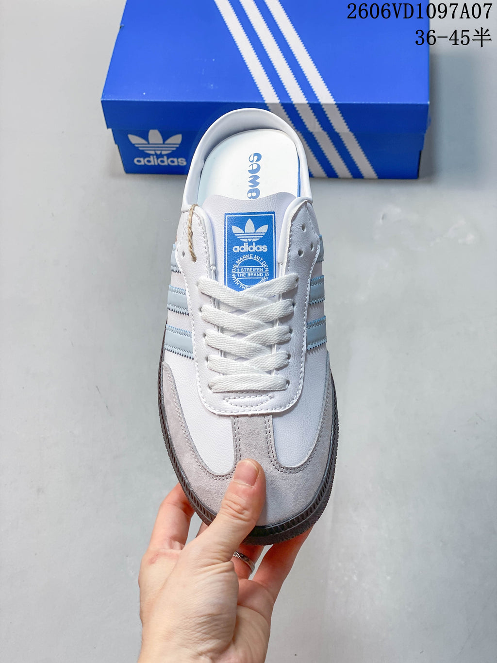 Front view of the lace-up adidas Samba OG mule with gray toe overlays