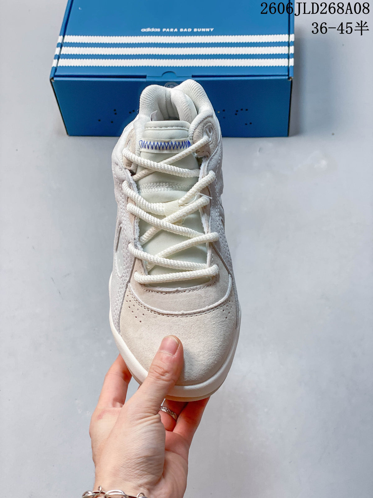 Front view showing the laces, tongue stitching, and perforated toe area