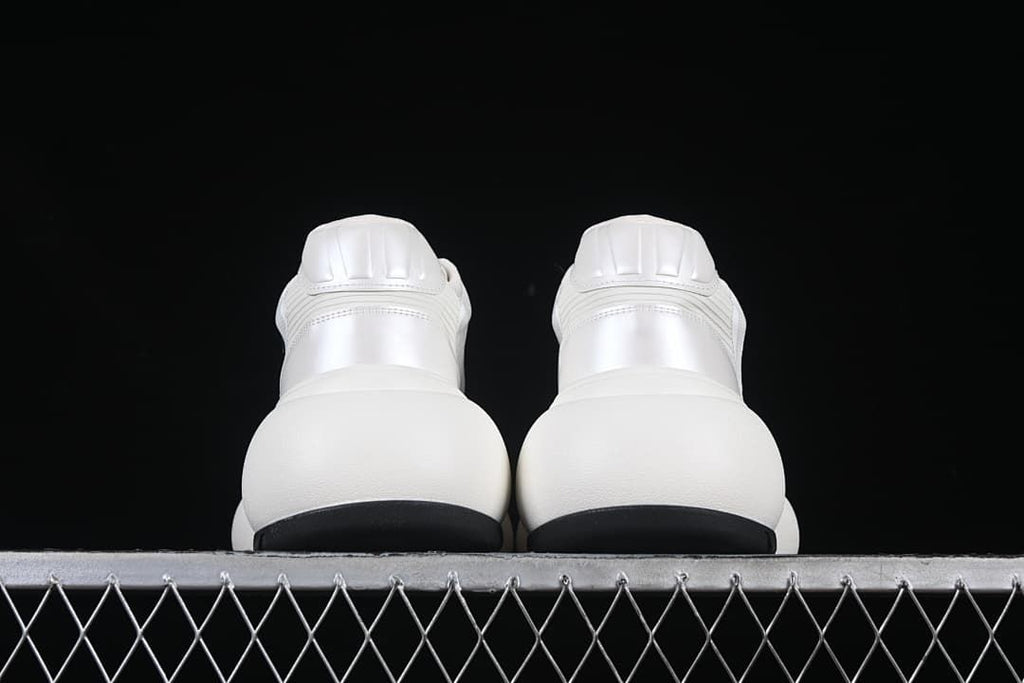 Rear view of the pair showing the heel panels and black outsole edges