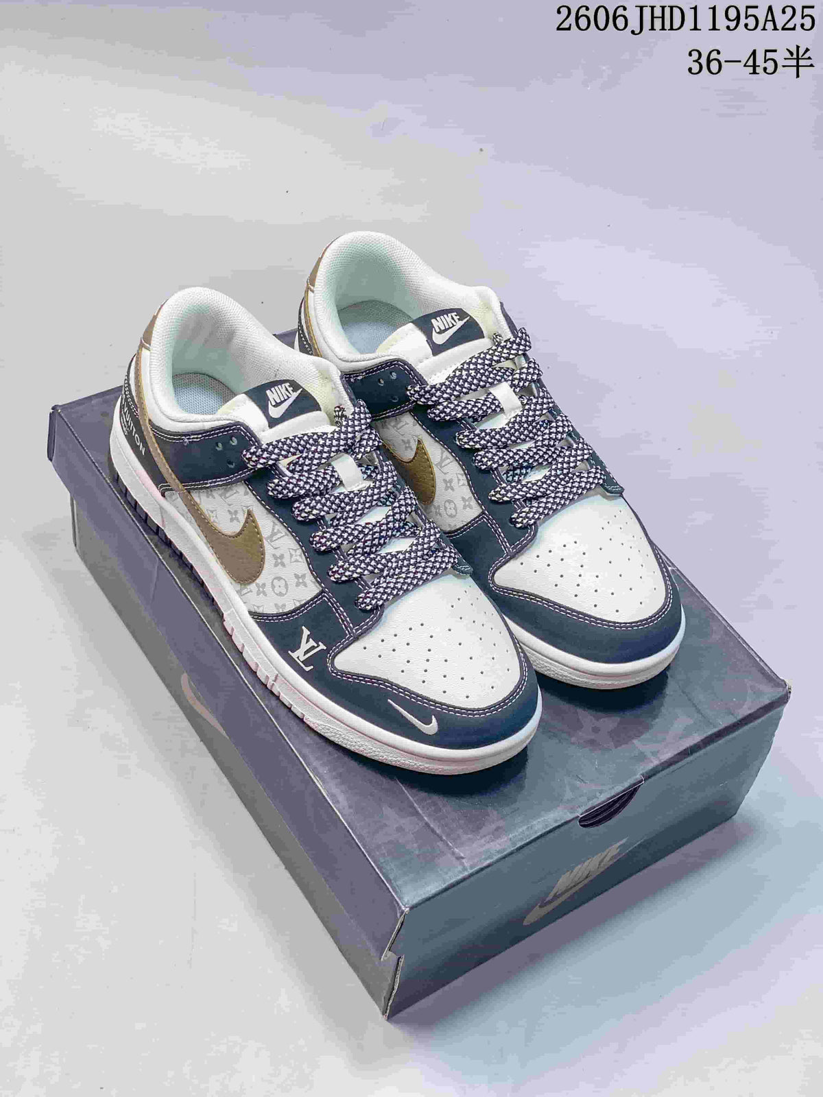 White and navy low-top sneakers with patterned side panels and patterned laces